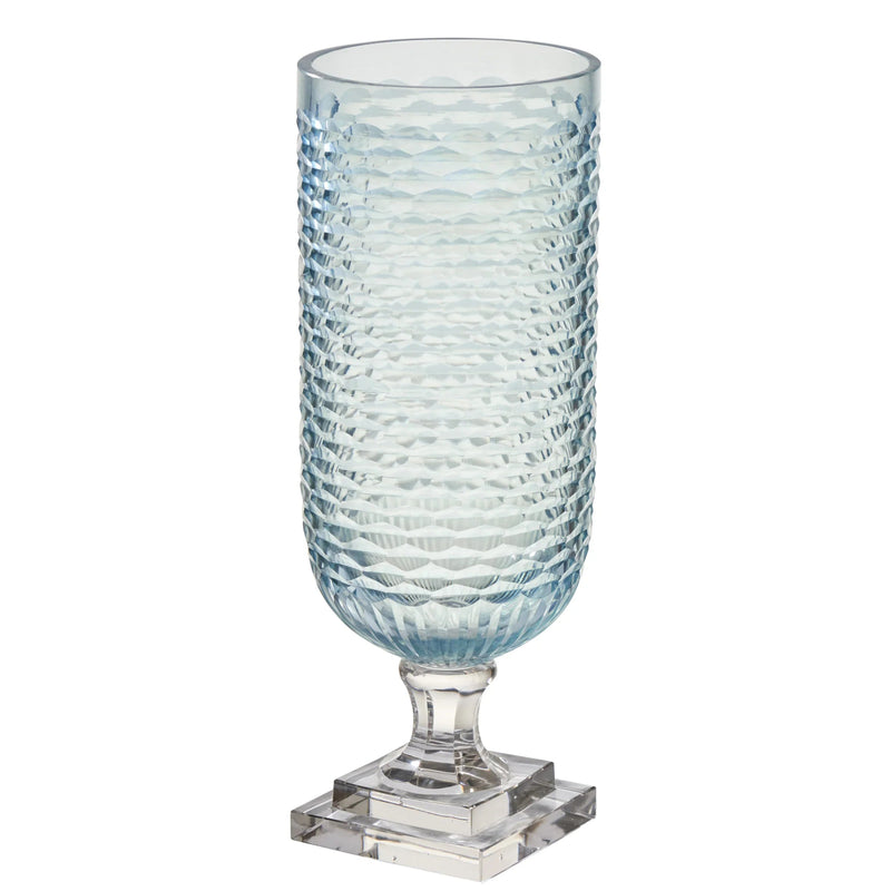 Blue textured glass vase on a white background