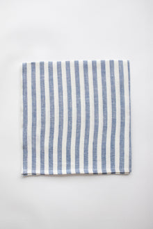 Blue and white linen napkin on white background