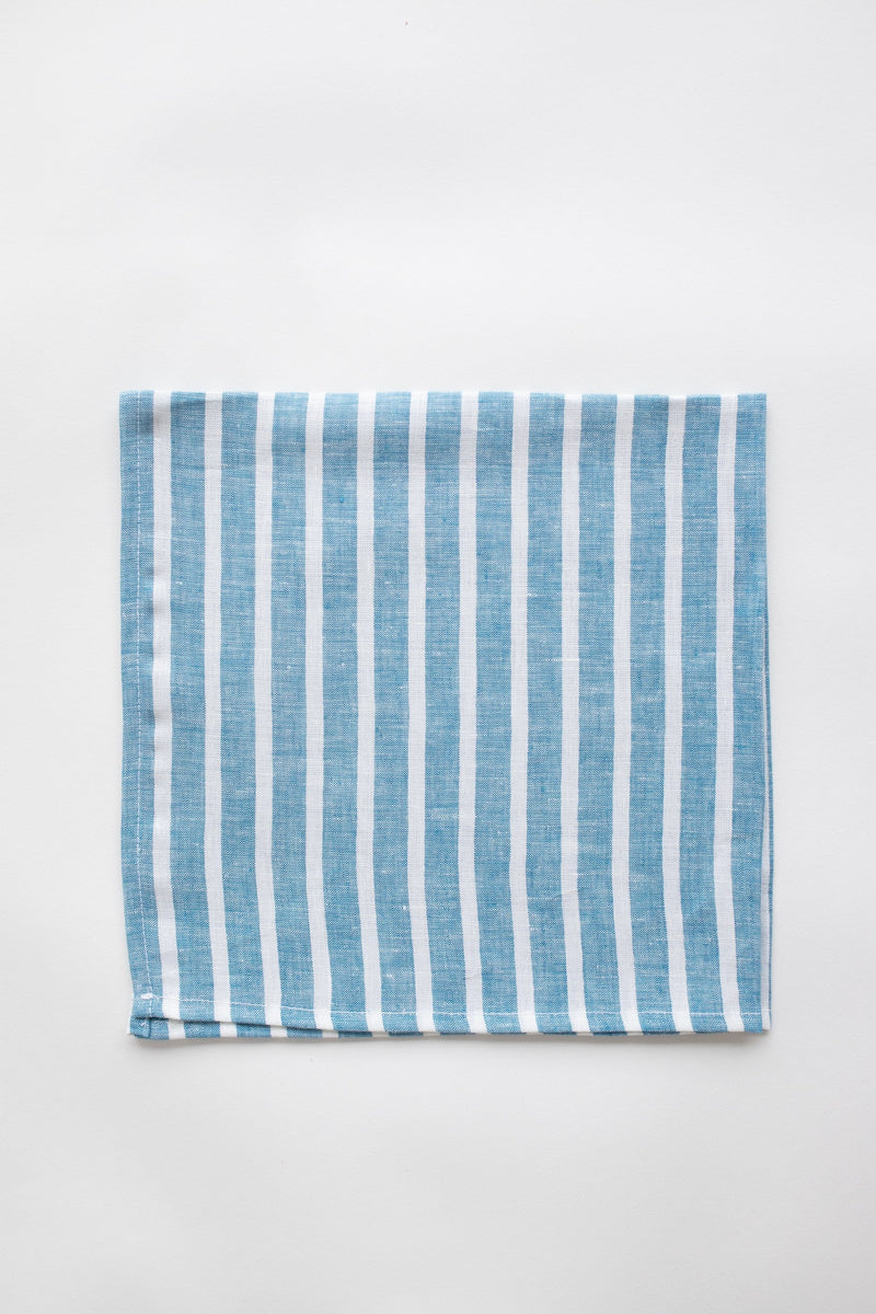 Blue and white striped napkin on white background