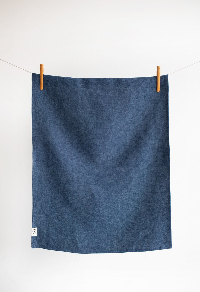 Blue linen placemat hanging on clothes line