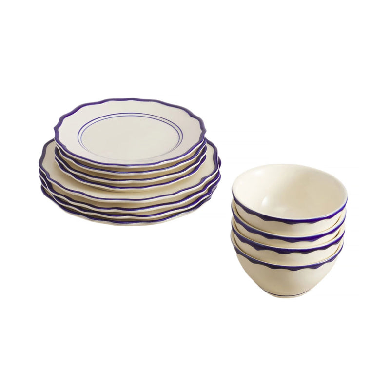 Set of ceramic plates and bowls with purple rim on a white background