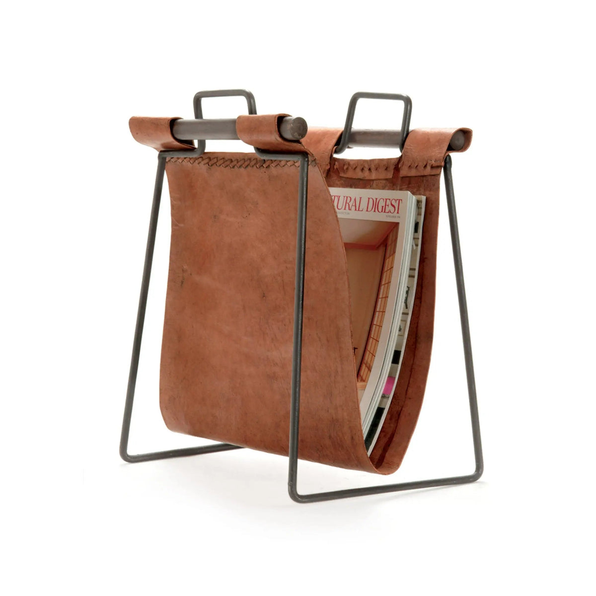 Brown leather magazine holder with metal legs on a white background