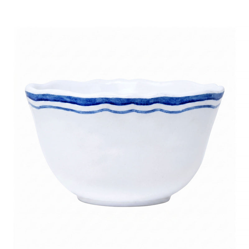 White ceramic bowl with blue decorative rim on a white background