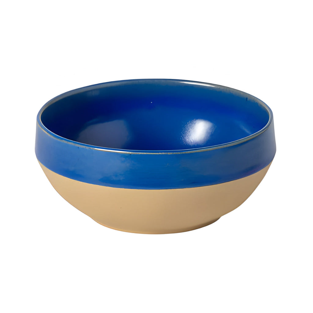 Two-toned blue and beige bowl on a white background
