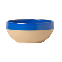 Two-toned blue and beige bowl on a white background