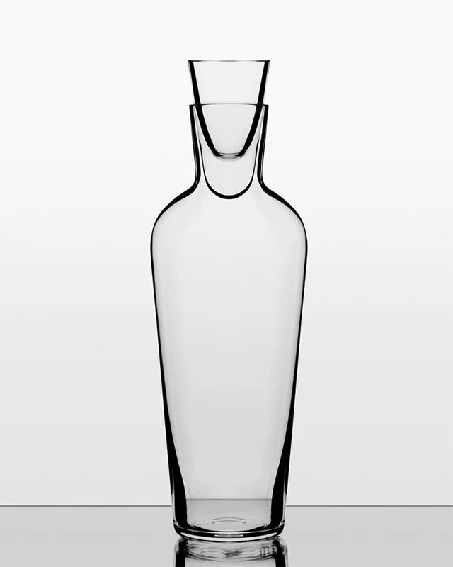 Clear glass carafe on a white background
