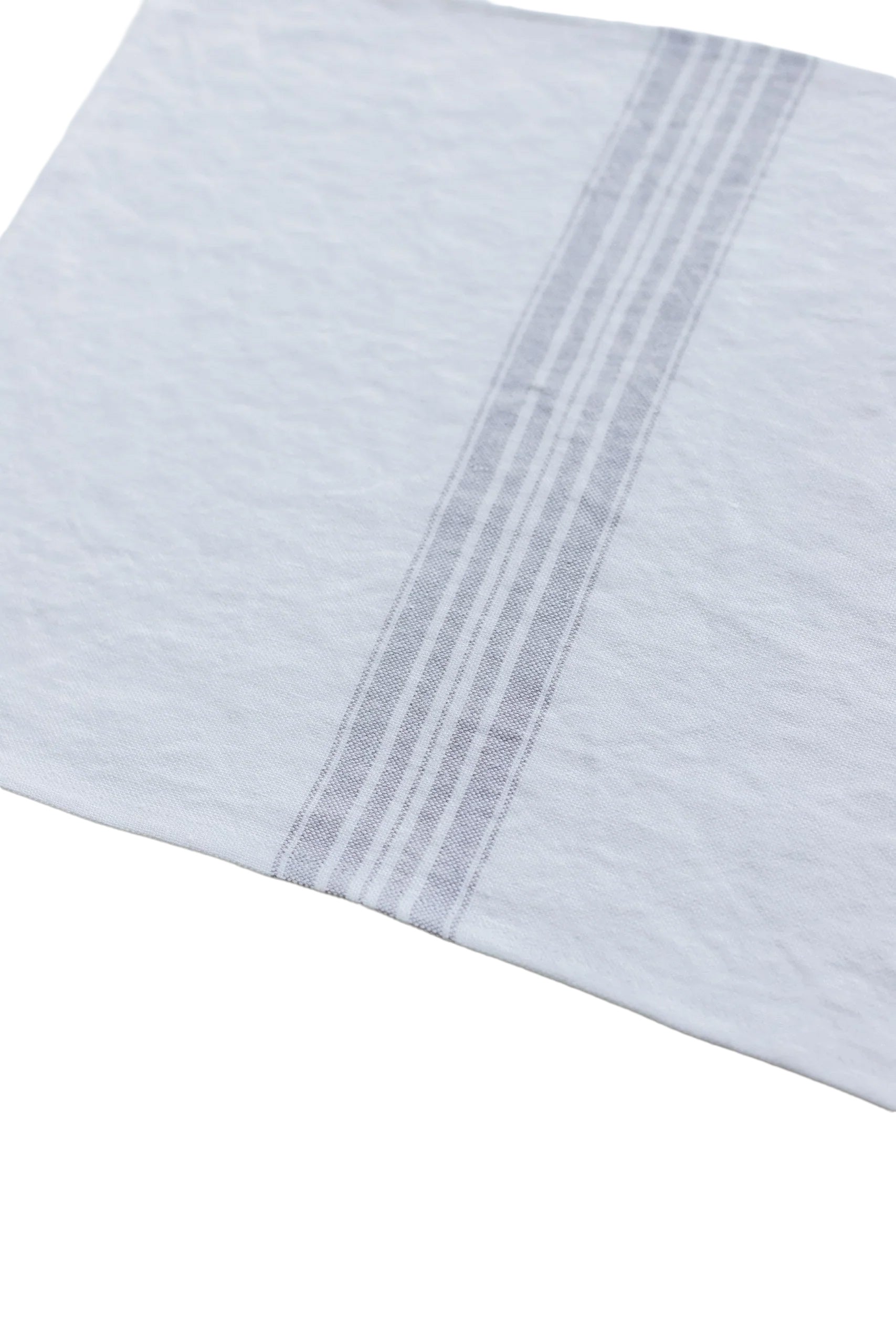 Close-up of a light blue fabric with a subtle pattern on a white background