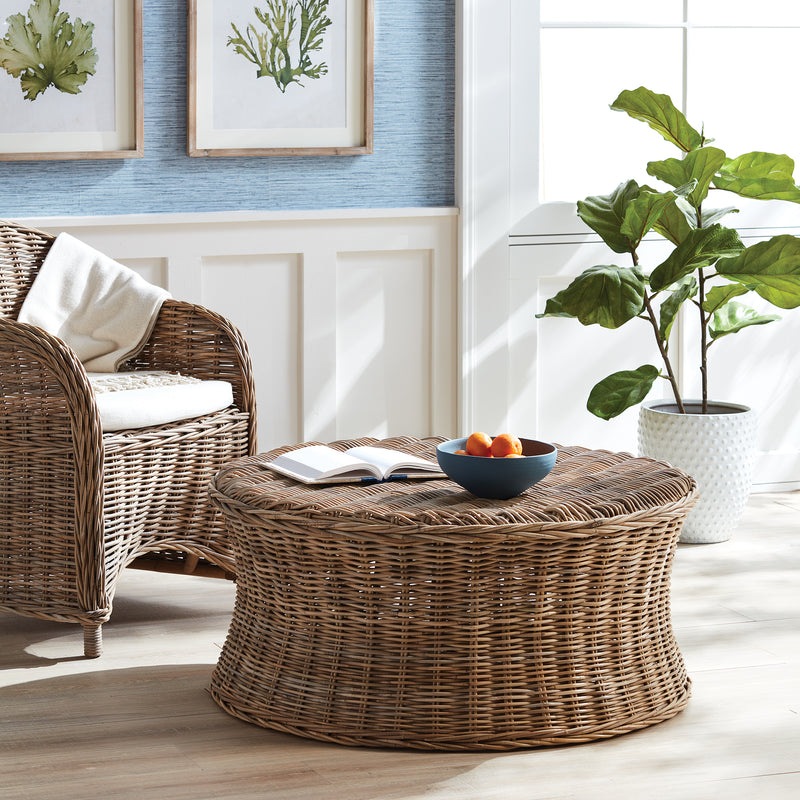 Woven wicker round stool in blue and white living room