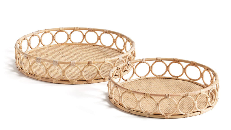 Two circular woven trays with circles around edge on white background