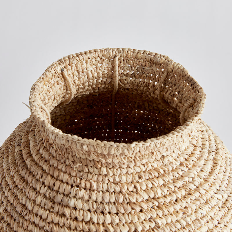 Top view of teardrop woven large vase on white background