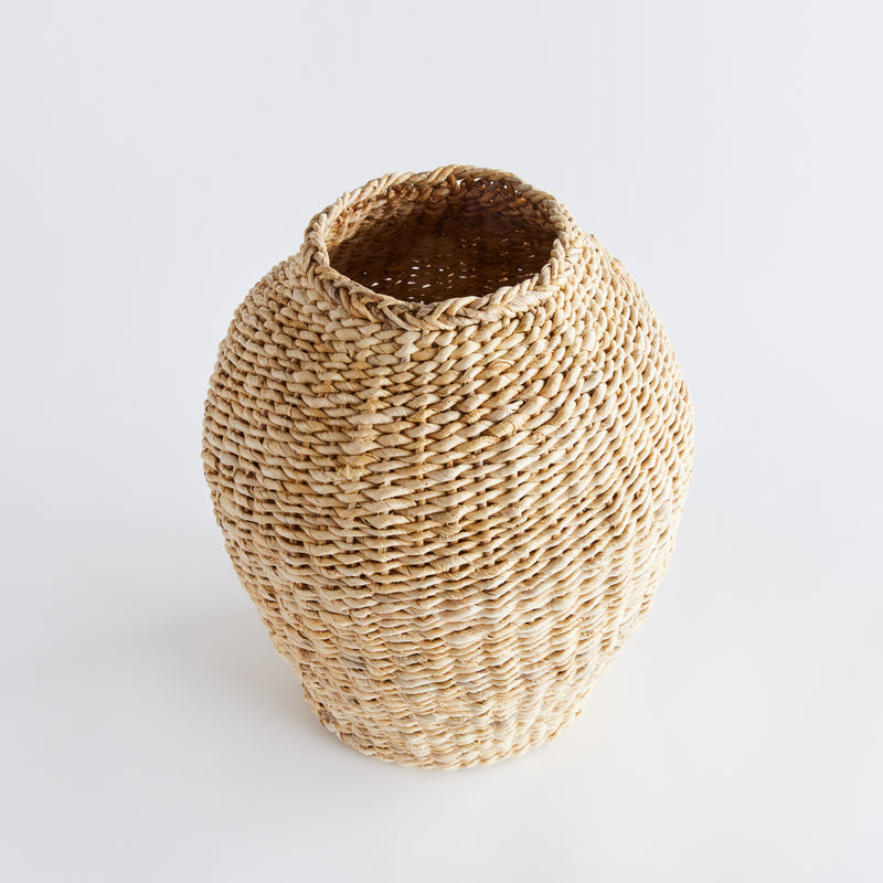 Woven seagrass standing vase on white background