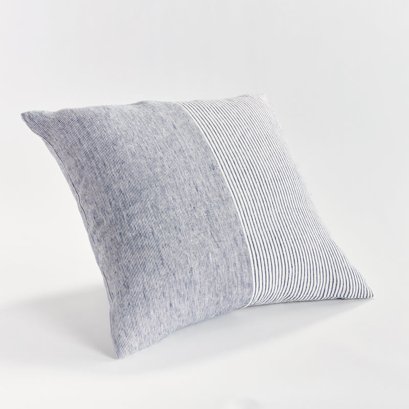 Square pinstripe pillow in blue and white on a white background