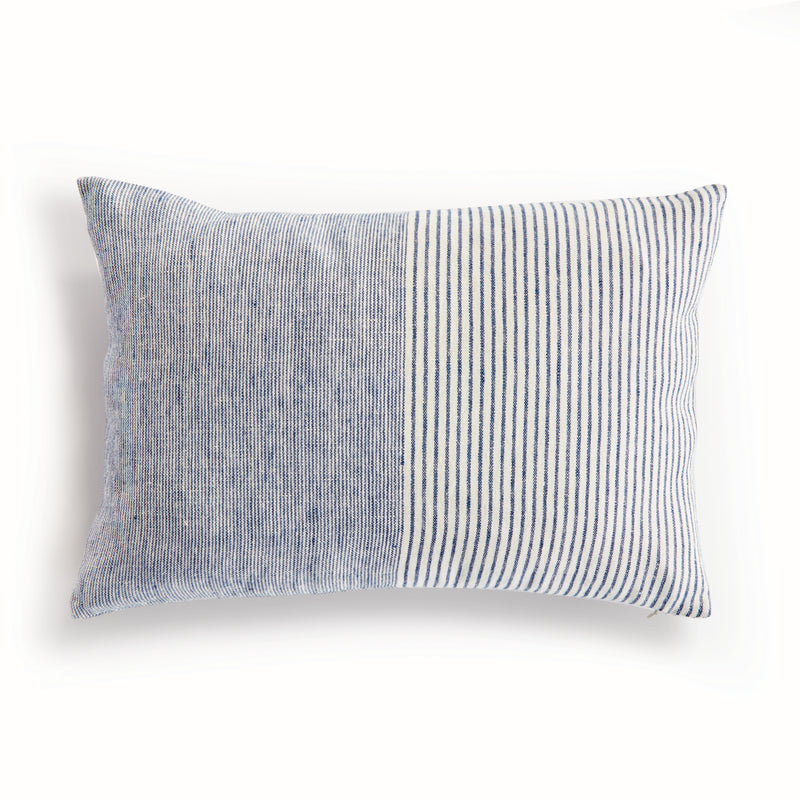 Rectangular pillow with thin blue stripes on white background