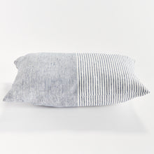 Rectangular pillow with thin blue stripes on white background