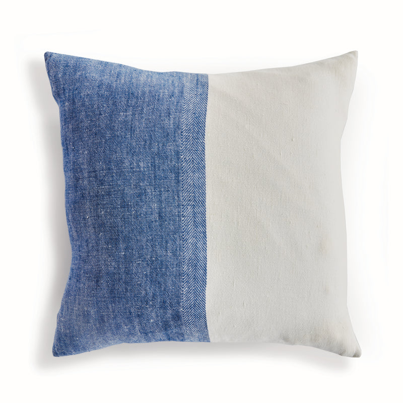 Half blue and half white square pillow on white background
