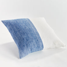 Half blue and half white square pillow on white background