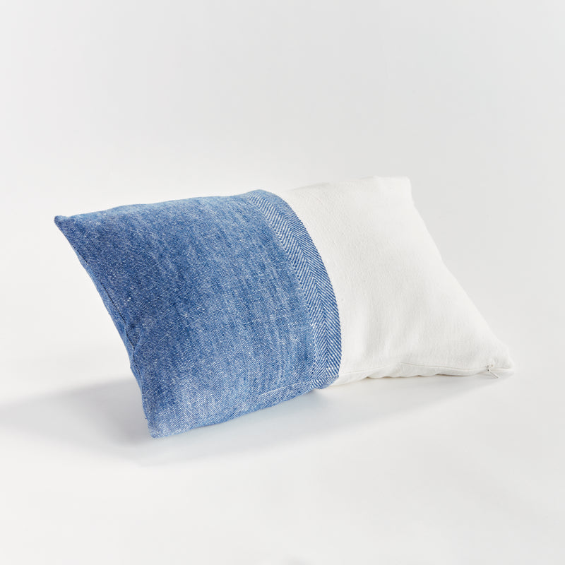 Half blue and half white rectangular pillow on white background