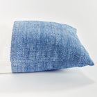Half blue and half white rectangular pillow on white background