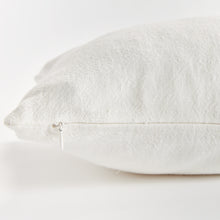 Close up of white rectangular pillow zipper on white background