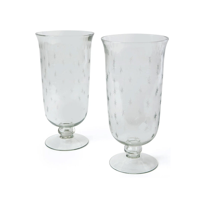 Two clear glass goblets with marble-like pattern on a white background