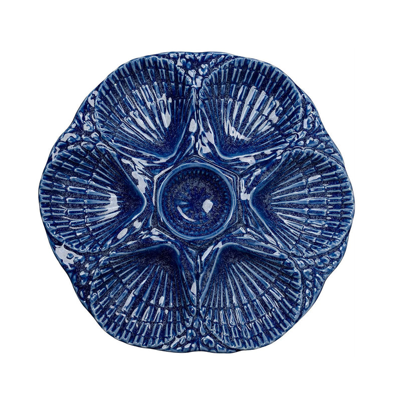 Blue ceramic plate with textured design on a white background
