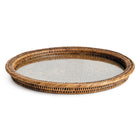 Circular rattan tray with glass insert on white background