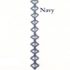 Navy blue decorative trim with a geometric pattern on a white background