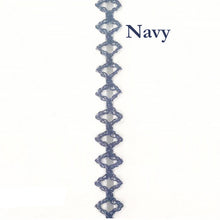 Navy blue decorative trim with a geometric pattern on a white background