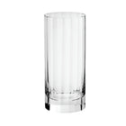 A clear fluted highball glass on a white background.
