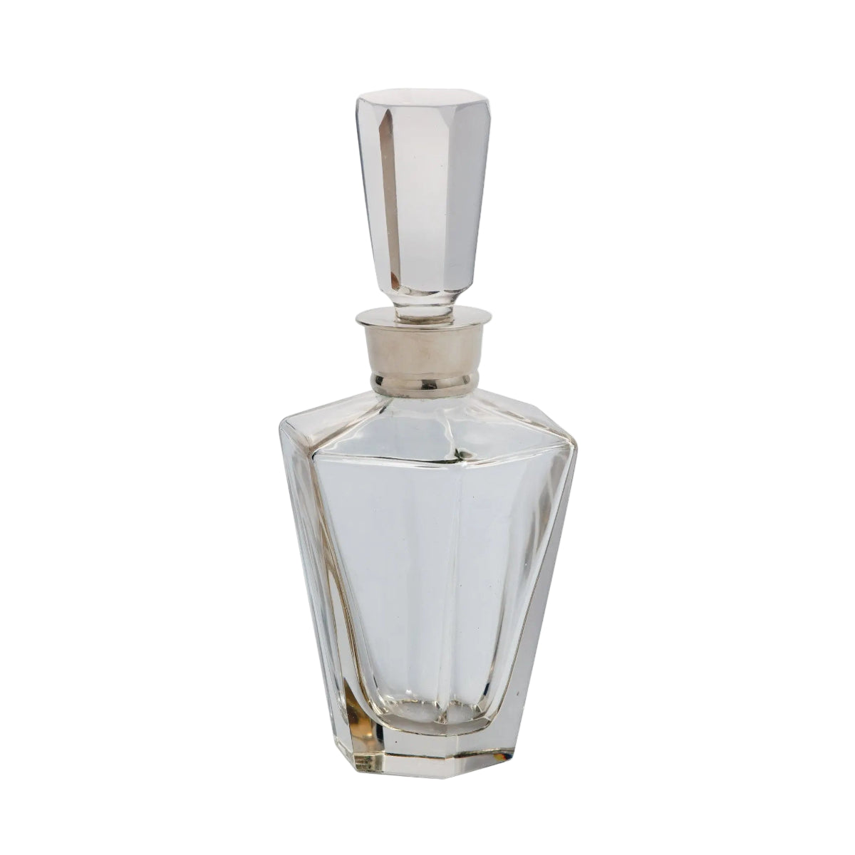 Clear glass perfume bottle with silver cap on a white background
