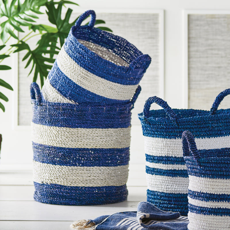 4 blue and white stripe rattan baskets with handles in a white room