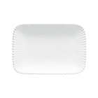 White ceramic plate with a textured rim on a white background