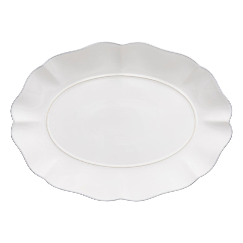 White scalloped-edge platter on a white background