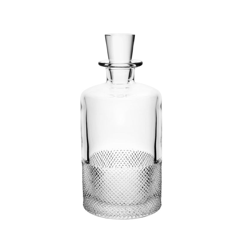 Clear glass decanter with textured base on a white background