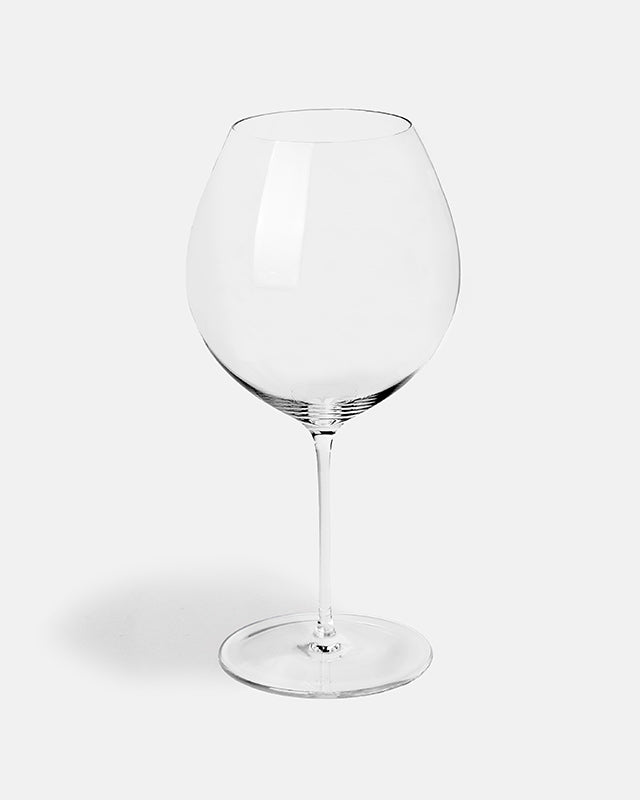 Clear wine glass on a white background