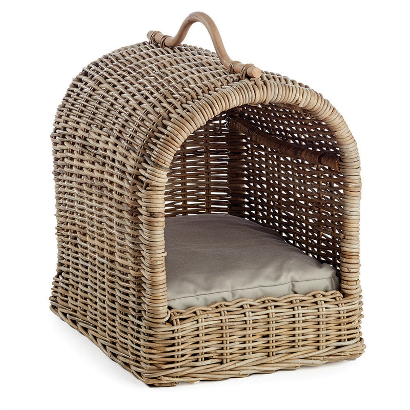 Woven wicker pet bed on a white background