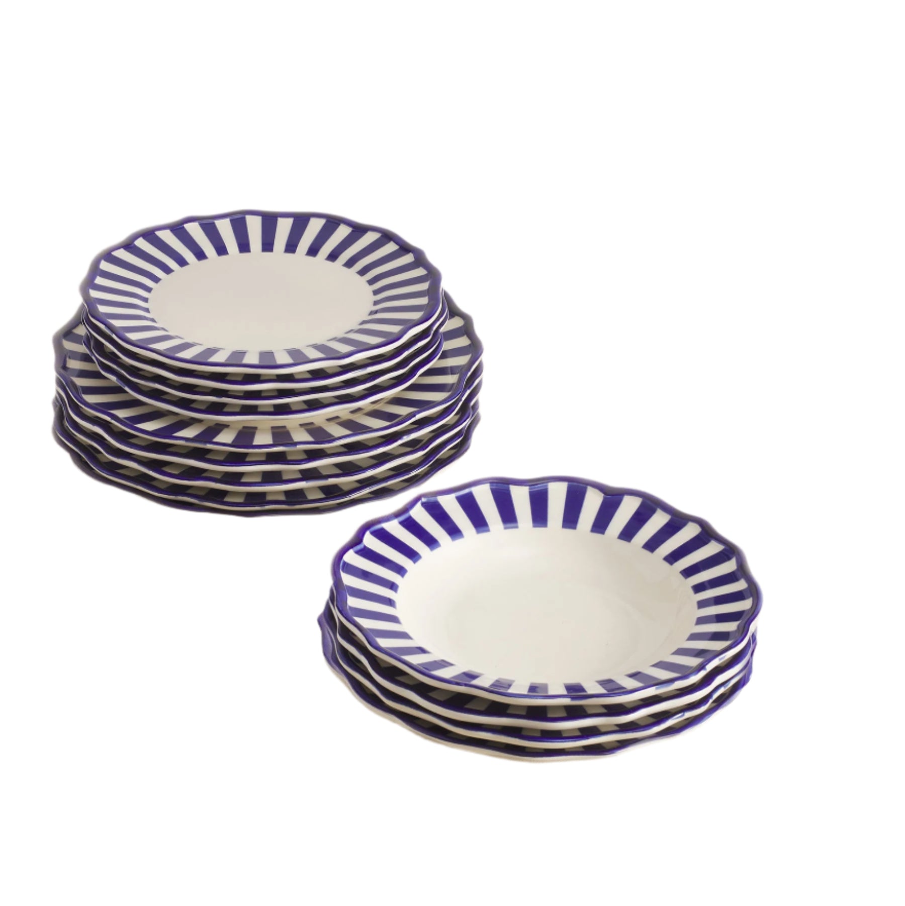Set of 12 white ceramic dinner plates, side plates and past bowls with blue stripes on a white surface.