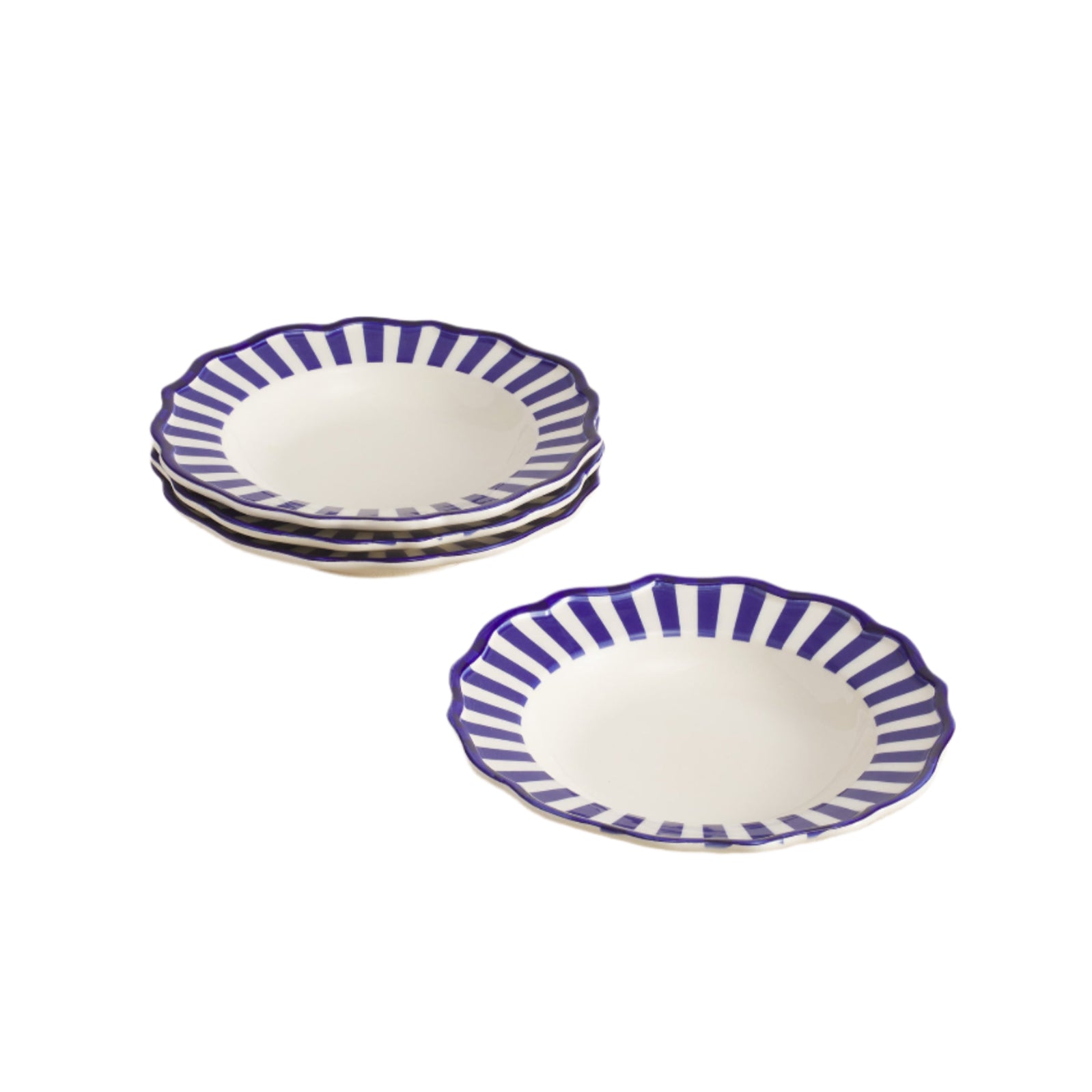 Set of 4 white ceramic pasta bowls with blue stripes on beige table
