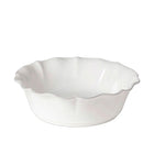 White ceramic pie dish with scalloped edge on a white background