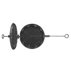 Black waffle maker on a beige background