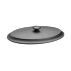 Black metal lid on a beige background
