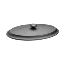Black metal lid on a beige background