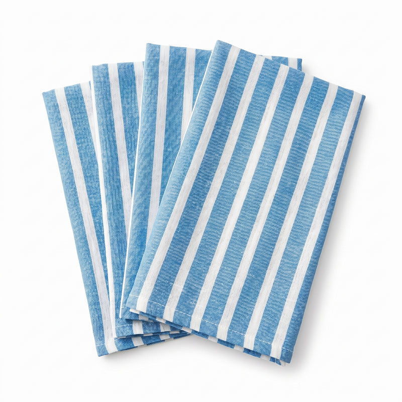 Set of blue and white striped napkins on a white background