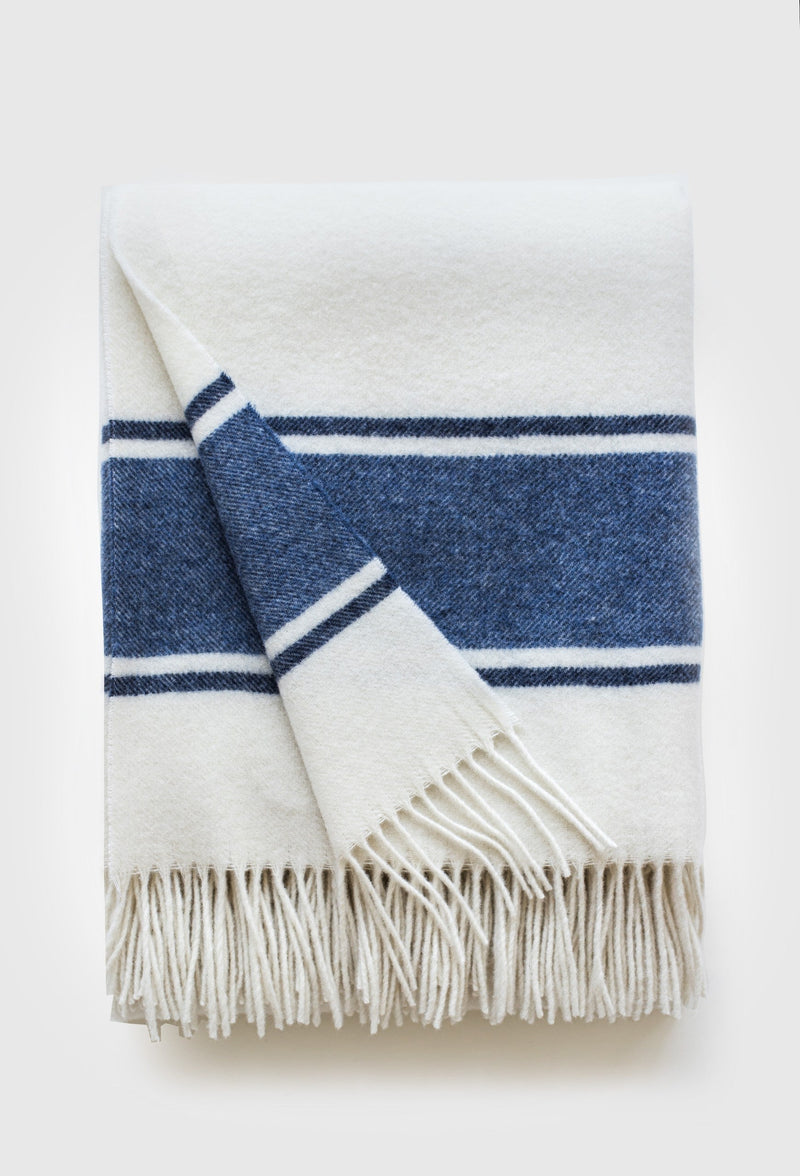 White wool throw with blue stripe on white background