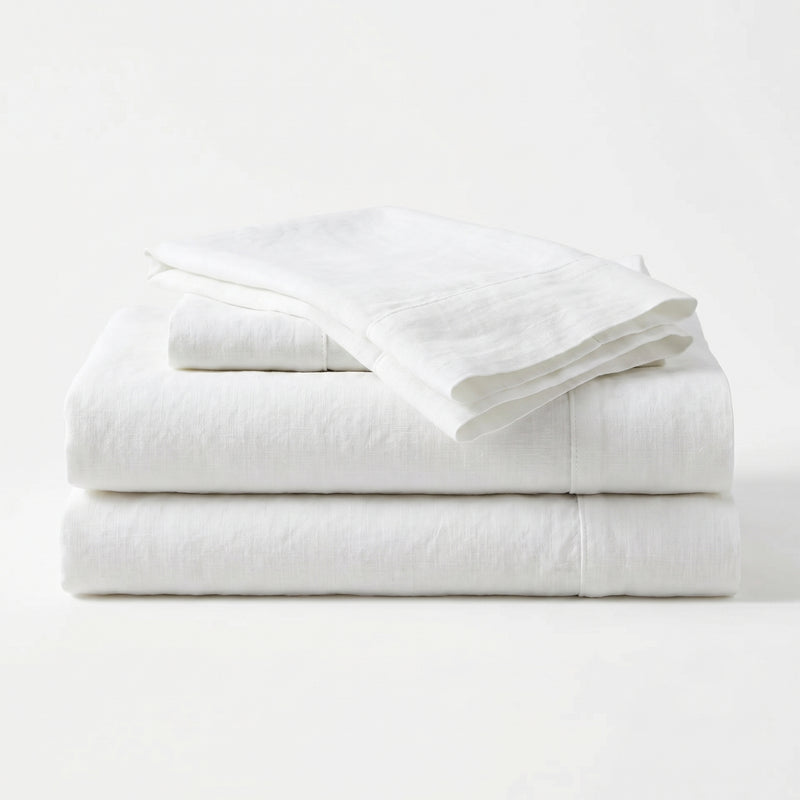 Stack of white folded towels on a white background