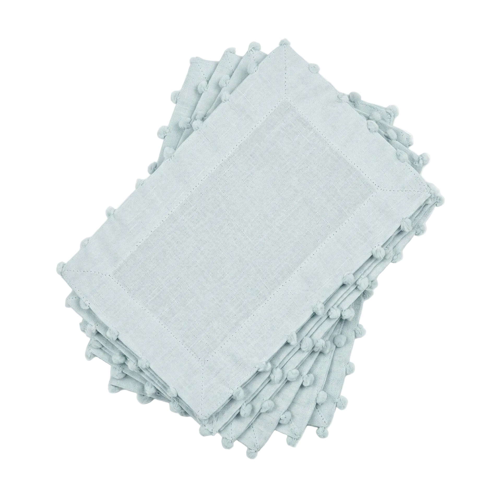 Stack of light blue napkins with tassels on a white background