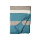 Folded blanket with blue, beige, and white stripes on a white background