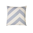 Decorative pillow with blue and white chevron pattern on a white background