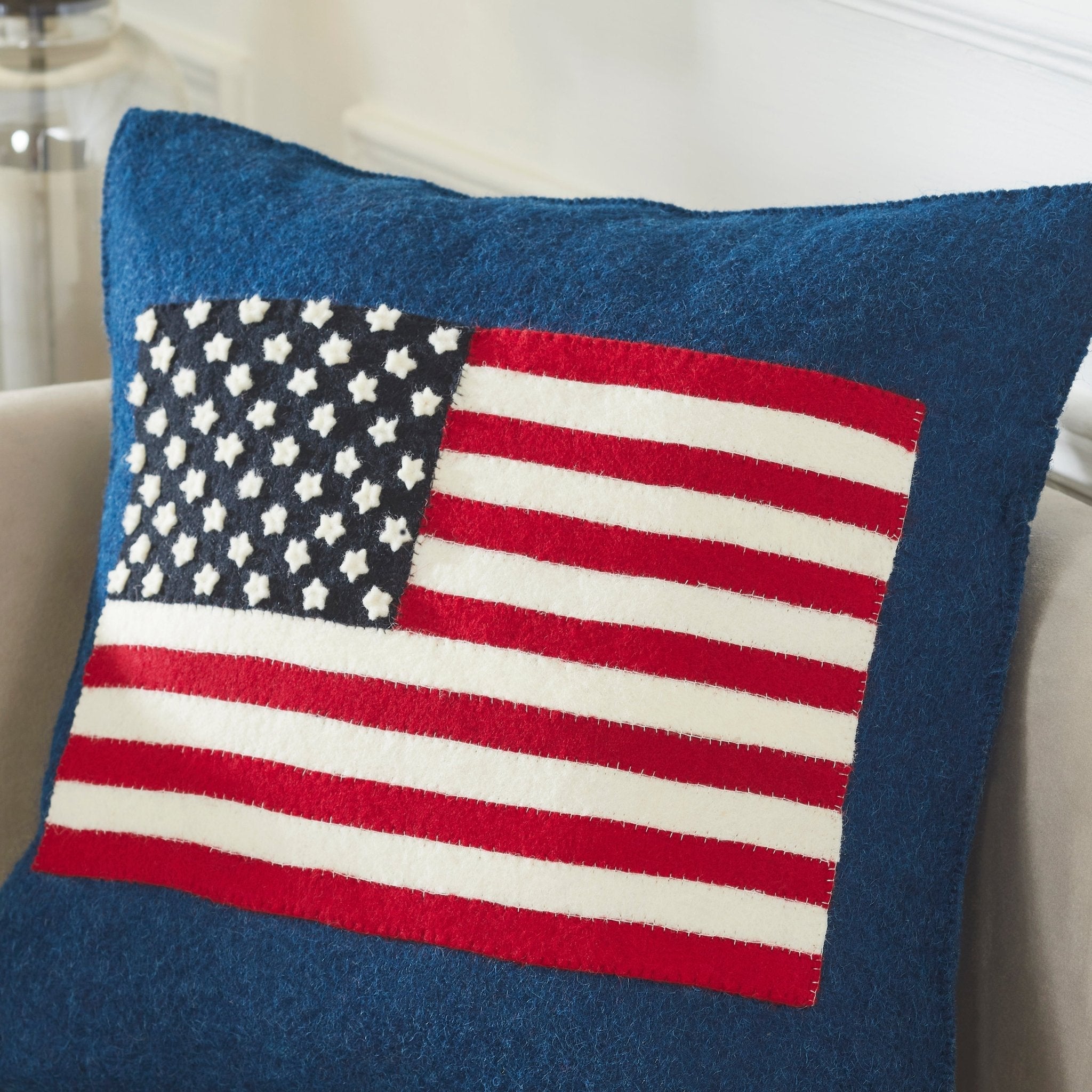 Pillow with American flag design on a neutral background
