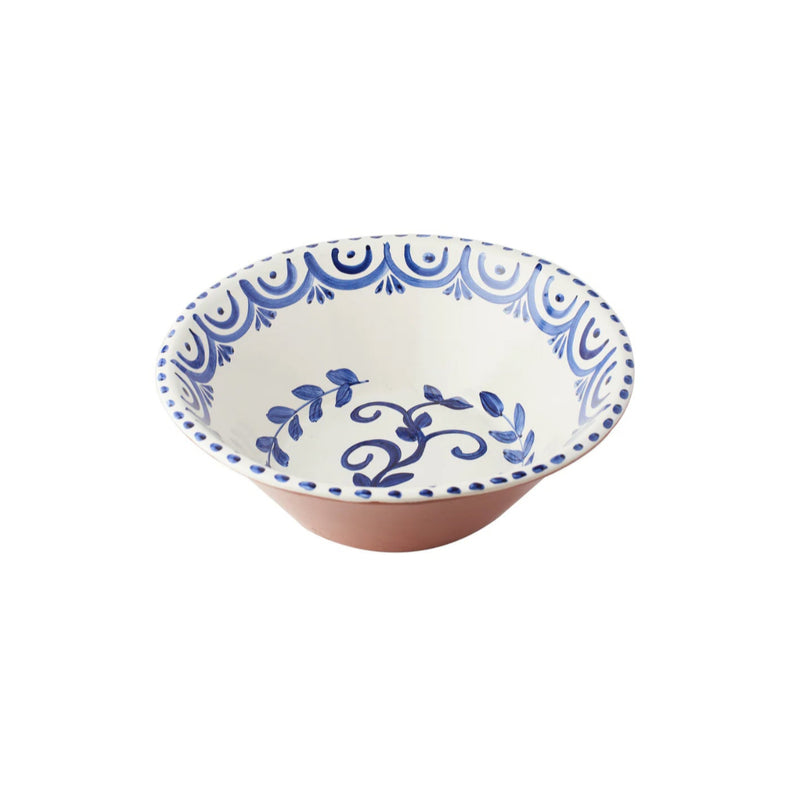 Ceramic bowl with blue floral patterns on a white background